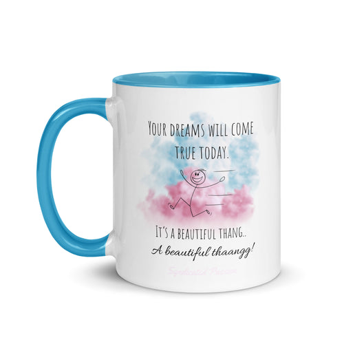 A white ceramic mug with a bright blue handle and interior, featuring a printed message about capturing dreams and cloud design in blue and pink on the front. With "Syndicated Passion" on the bottom. 