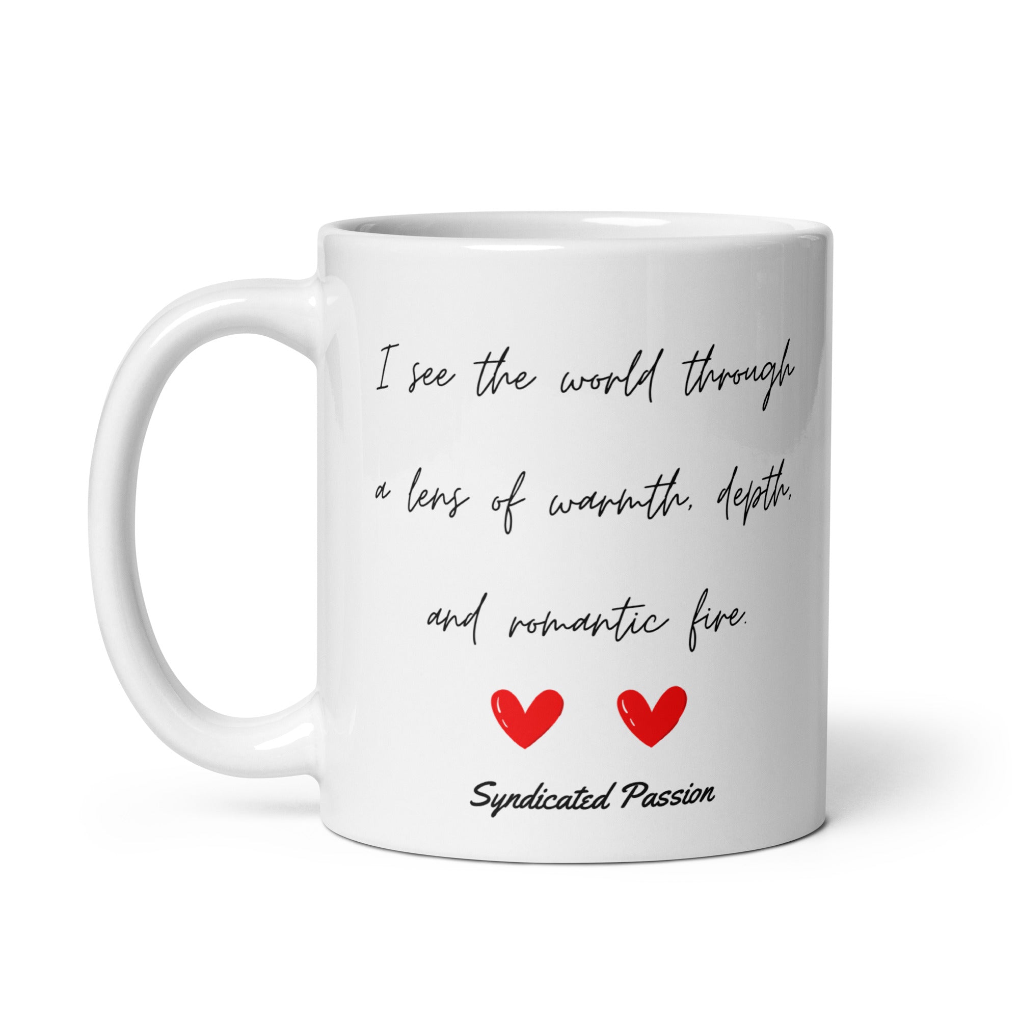 Classic white mug, two red hearts, black cursive script: "I see the world through a lens of warmth, depth, and romantic fire. Syndicated Passion written on the bottom of the mug. 