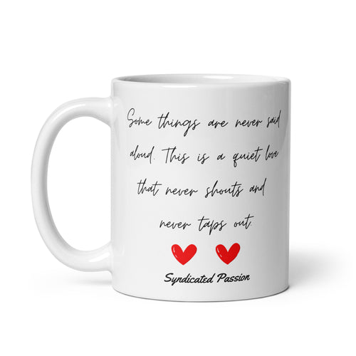 A Quiet Love white glossy ceramic coffee mug — elegant black handwritten script with two bold red hearts and Syndicated Passion signature, original love poetry reads Some things are never said aloud, This is a quiet love that never shouts and never taps out by Syndicated Passion.