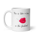 White glossy 11 oz ceramic mug with original poetry reading "This is like a kiss on the forehead" in elegant script alongside a winged red lips illustration — a romantic gift for her by Syndicated Passion