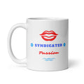 White ceramic coffee mug featuring red lips above blue “SYNDICATED” lettering and red “Passion” script, with blue flower and wavy-line accents.