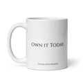 White classic 11 oz. coffee mug with black “Own it today.” motivational lettering and Syndicated Passion branding on the bottom.